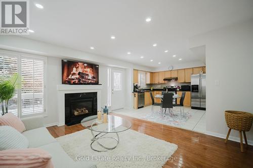 1627 Samuelson Circle, Mississauga, ON - Indoor Photo Showing Living Room With Fireplace