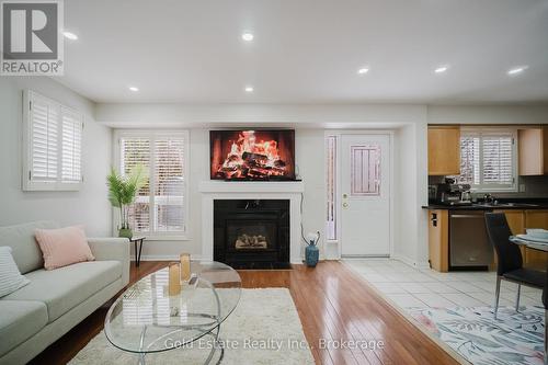 1627 Samuelson Circle, Mississauga, ON - Indoor Photo Showing Living Room With Fireplace