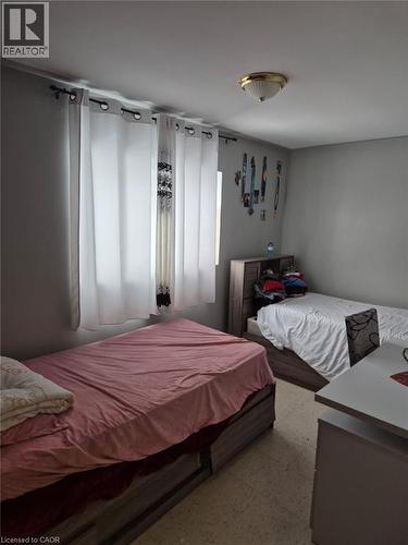 Bedroom with tile patterned floors - 76 Brybeck Crescent Unit# 303, Kitchener, ON - Indoor Photo Showing Bedroom