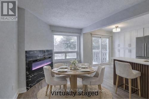 62 - 2350 Grand Ravine Drive, Oakville, ON - Indoor Photo Showing Dining Room With Fireplace
