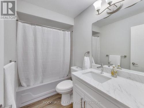 New toilet and vanity with quartz countertop - 62 - 2350 Grand Ravine Drive, Oakville, ON - Indoor Photo Showing Bathroom