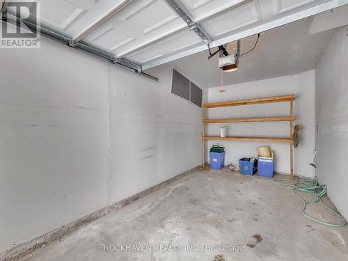 Rectangular garage with storage - 62 - 2350 Grand Ravine Drive, Oakville, ON - Indoor Photo Showing Garage