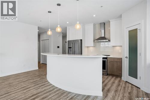 201 3581 Evans Court, Regina, SK - Indoor Photo Showing Kitchen With Upgraded Kitchen