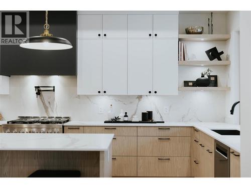 Abundant kitchen storage with thoughtful designed cabinetry - 5533 Foothill Court, Kelowna, BC - Indoor Photo Showing Kitchen With Upgraded Kitchen