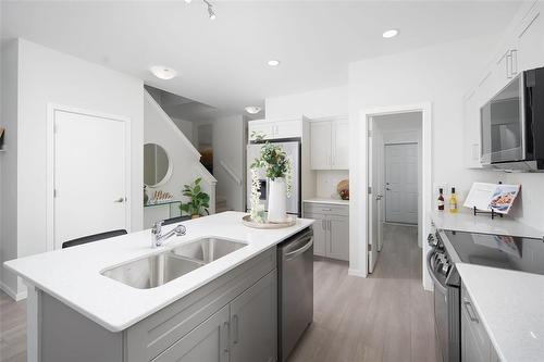 190 Moonlight Bay, Winnipeg, MB - Indoor Photo Showing Kitchen With Double Sink