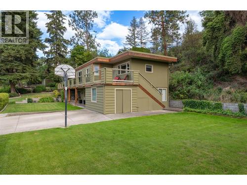 Lawn on the left side of the property - 391 Braeloch Road, Kelowna, BC - Outdoor With Deck Patio Veranda