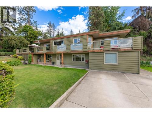 Access to the wrap around deck from both lawns - 391 Braeloch Road, Kelowna, BC - Outdoor With Deck Patio Veranda