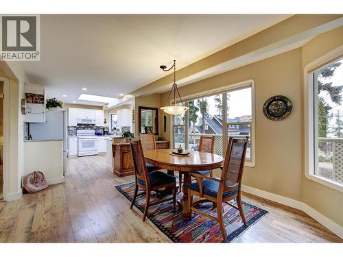 Dining room with partial lake views! - 391 Braeloch Road, Kelowna, BC - Indoor Photo Showing Dining Room