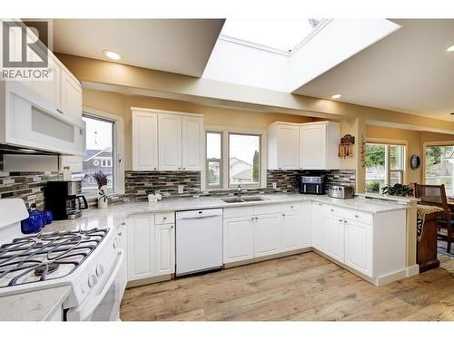 Ample natural light from the skylight - 391 Braeloch Road, Kelowna, BC - Indoor Photo Showing Kitchen With Double Sink