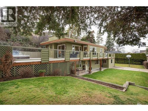 Lawn on the left side of the property - 391 Braeloch Road, Kelowna, BC - Outdoor With Deck Patio Veranda
