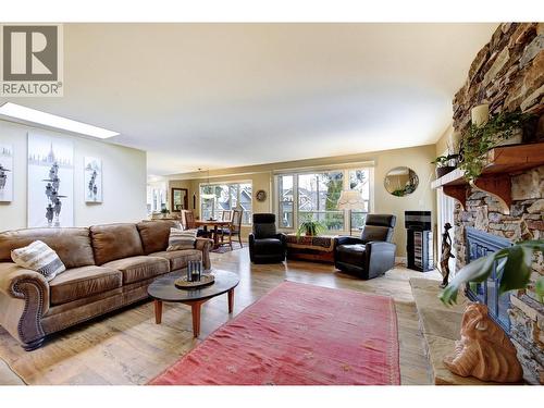 Main Floor - Spacious living room with tons of natural light - 391 Braeloch Road, Kelowna, BC - Indoor Photo Showing Living Room With Fireplace