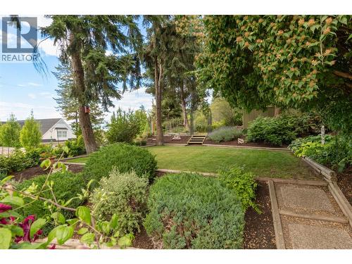 Dining room with partial lake views! - 391 Braeloch Road, Kelowna, BC - Indoor Photo Showing Dining Room
