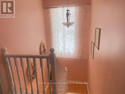 Hall way to second level with Large window - 