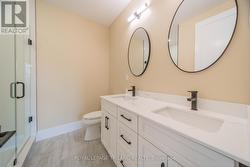 Master ensuite bathroom w/ glass door tile shower - 