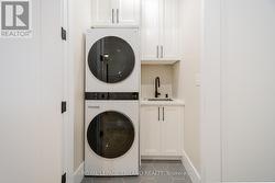 Main level laundry room with sink - 