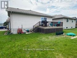 Enjoy outdoor living on the spacious deck and yard - 