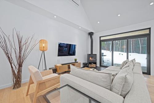 Salon - 65 Rue Des Trilles, La Conception, QC - Indoor Photo Showing Living Room With Fireplace