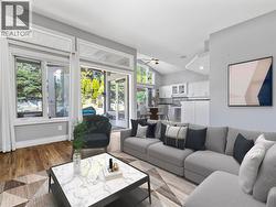 *virtually staged* Family room open to kitchen and backyard - 