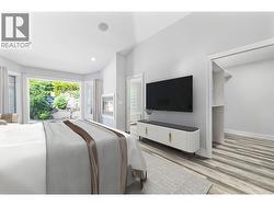 *virtually staged* Primary bedroom with fireplace, sitting area and open to private backyard and hot tub - 