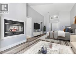 *virtually staged* Primary bedroom with fireplace, sitting area and open to private backyard and hot tub - 