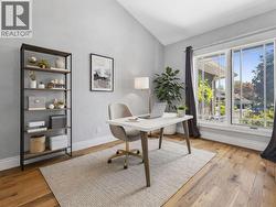 *virtually staged* home office off hte entryway - 