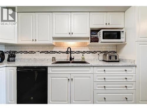 Kitchen with plenty of counter and cabinet space - 265 Froelich Road Unit# 204, Kelowna, BC - Indoor Photo Showing Kitchen With Double Sink