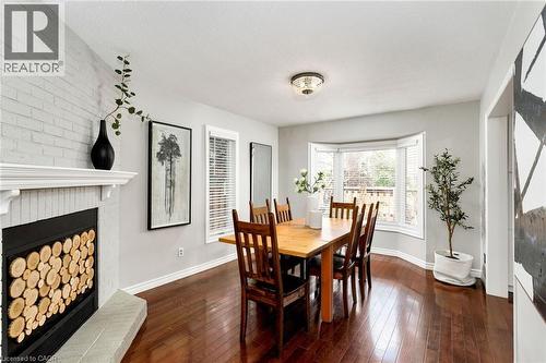2006 Glenada Crescent Unit# 7, Oakville, ON - Indoor Photo Showing Dining Room With Fireplace