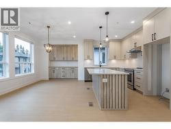 Spacious Kitchen with Island, plenty of Natural Light - 