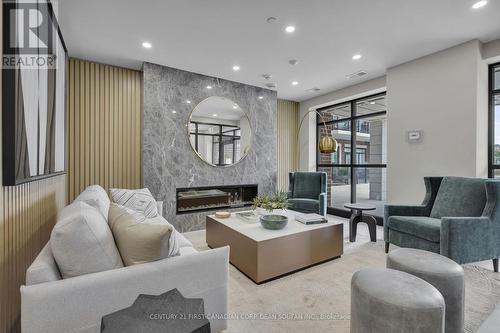 201 - 1975 Fountain Grass Drive, London South (South B), ON - Indoor Photo Showing Living Room With Fireplace