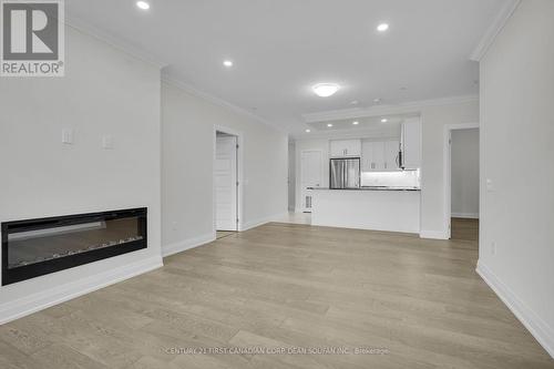 201 - 1975 Fountain Grass Drive, London South (South B), ON - Indoor Photo Showing Other Room With Fireplace