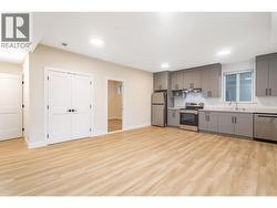 Basement Suite Living Room looking into Kitchen - 