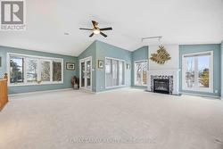 Great room leads out to upper enclosed balcony - 