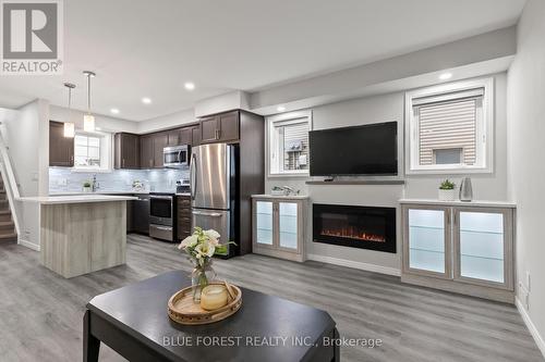 50 - 3200 Singleton Avenue, London South (South W), ON - Indoor With Fireplace