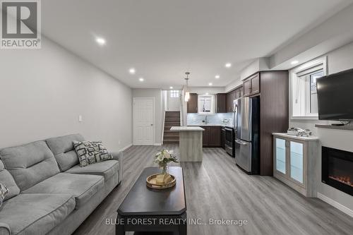 50 - 3200 Singleton Avenue, London South (South W), ON - Indoor Photo Showing Living Room With Fireplace