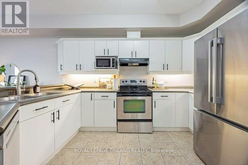 8 - 2089 Beaverbrook Avenue, London North (North M), ON - Indoor Photo Showing Kitchen With Double Sink