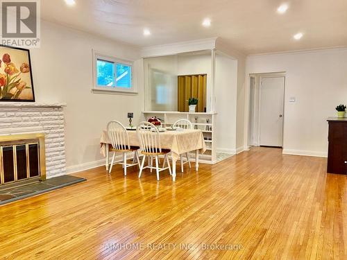 12 Canham Crescent, Toronto, ON - Indoor Photo Showing Dining Room With Fireplace