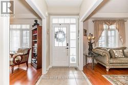 ELEGANT ENTRY OPENS TO A CUSTOM OPEN STAIRCASE. - 