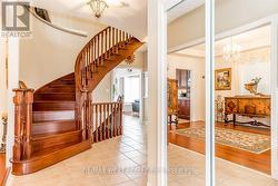 HALLWAY WITH CUSTOM OAK STAIRS, OPEN TO BELOW. - 