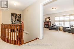 SPACIOUS UPPER HALLWAY LEADING TO THE MAIN BEDROOM - 