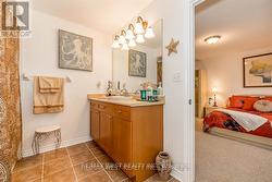 SHARED ENSUITE BATH, RAISED CUSTOM CABINET/SINK. - 