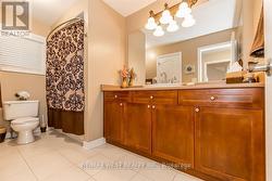 SHARED ENSUITE BATH, RAISED CUSTOM CABINET/SINK. - 