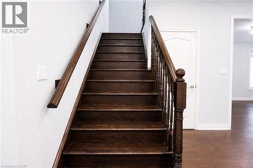 Stairway featuring baseboards and wood finished floors - 127 Elmbank Trail Unit# Upper, Kitchener, ON - Indoor Photo Showing Other Room