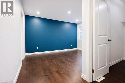Unfurnished room with recessed lighting and dark wood-style flooring - 127 Elmbank Trail Unit# Upper, Kitchener, ON - Indoor Photo Showing Other Room