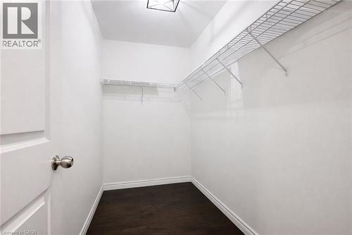Walk in closet with dark wood finished floors - 127 Elmbank Trail Unit# Upper, Kitchener, ON - Indoor With Storage