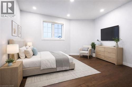 Bedroom with dark wood finished floors and recessed lighting - 127 Elmbank Trail Unit# Upper, Kitchener, ON - Indoor Photo Showing Bedroom