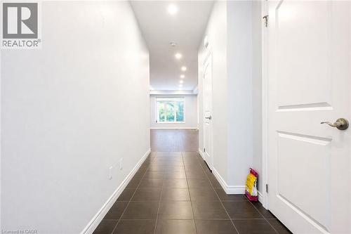 Hallway featuring recessed lighting and dark tile patterned flooring - 127 Elmbank Trail Unit# Upper, Kitchener, ON - Indoor Photo Showing Other Room
