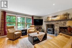 Livingroom wall of windows & fireplace Jotul stove - 