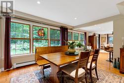 Wall of windows continue thru to the dining room - 