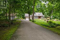 Paved driveway leads you home - 