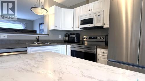 2 1621 First Street, Estevan, SK - Indoor Photo Showing Kitchen With Double Sink